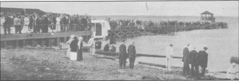 The regular crowds at the bandstand on Third Street dock, Bemidji Minnesota.