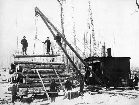 Loading logs on sled with a steam loader, Nixon camp near Akeley, 1904